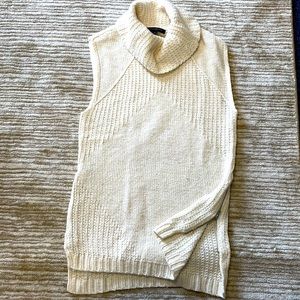 Cream cowell neck sleeveless top.